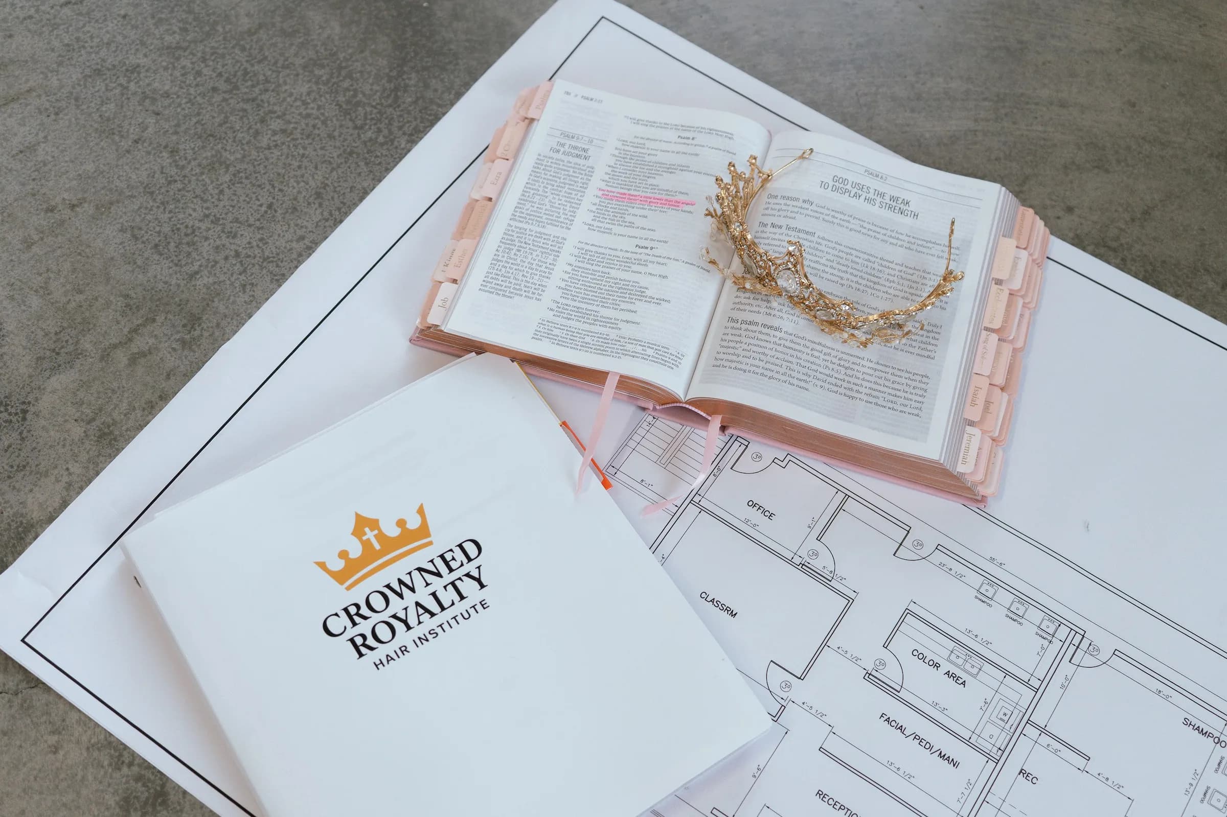A gold crown resting on an open Bible