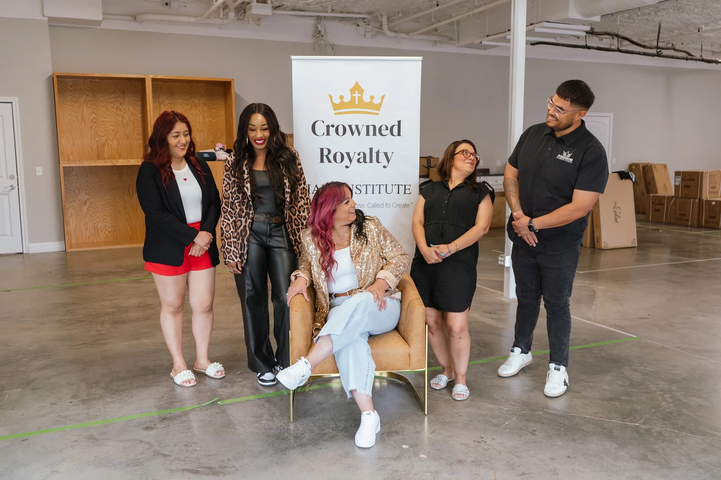 The Crowned Royalty Hair Institute team gathered at the Bryan studio